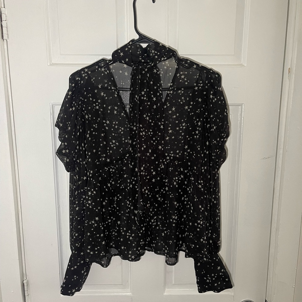 This cute blouse with stars will make you shine as you enter the room.